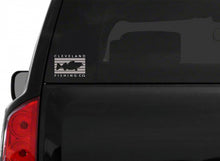 A grey rectangle with a walleye in the center surrounded by Cleveland Fishing Co. on the back of a black SUV windshield.