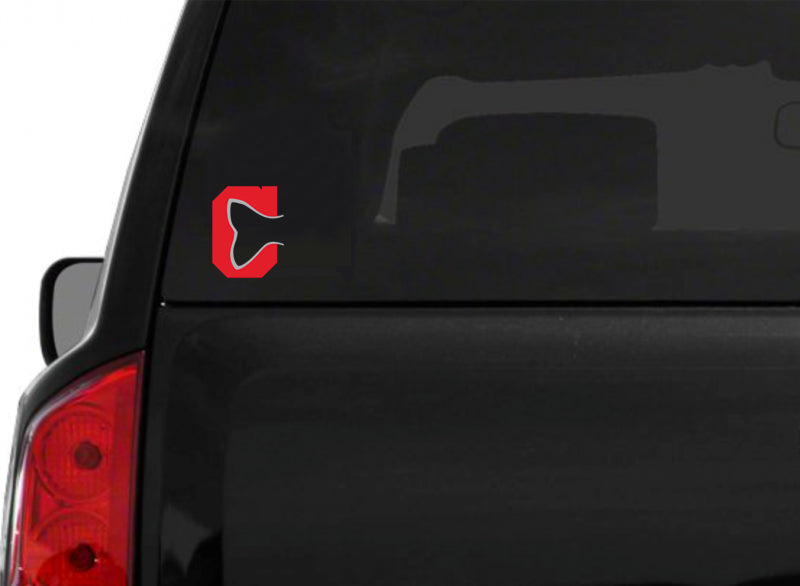 A red block C logo in the shape of a fishtail on the back windshield of an SUV. 