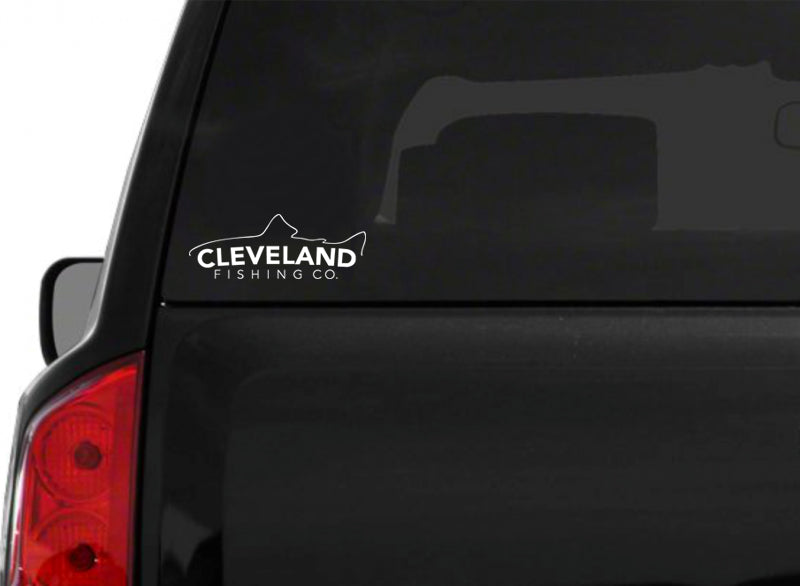 White Cleveland Fishing Co. fish sticker on the back of a black SUV windshield. 